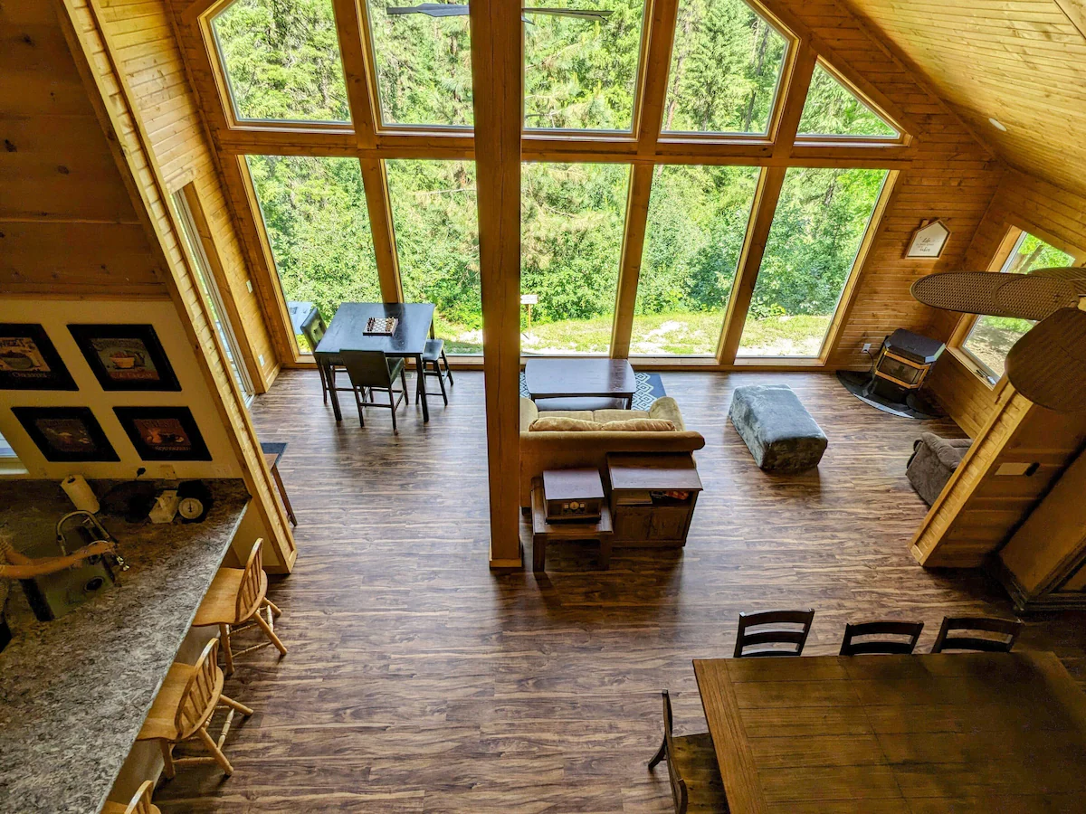 Aerial view of open-plan living and dining area with cathedral windows