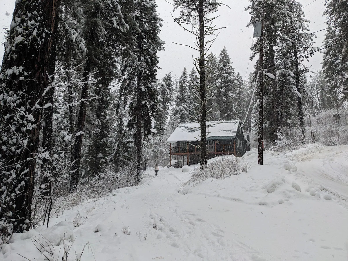 Crouch Cabin surrounded by deep snow in winter